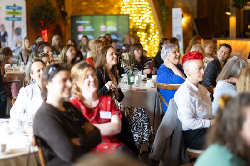 Miriam Simon speaking to a full audience at a Women in Business event